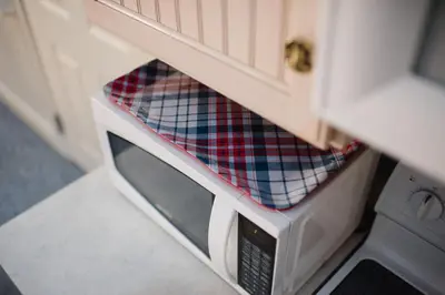 a microwave oven sitting inside of a kitchen at Chapman House in Put-in-Bay