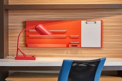 a desk with a red telephone in a drawer at TownePlace Suites by Marriott Columbus North - OSU in Columbus