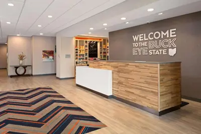 a lobby with a welcome to the buck eye share sign at Hampton Inn Circleville, Oh in Circleville