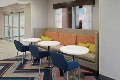 a living room with two tables and a couch at Hampton Inn Circleville, Oh in Circleville