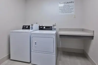 a white kitchen with a dishwasher and a counter at Holiday Inn Express & Suites Wooster by IHG in Wooster
