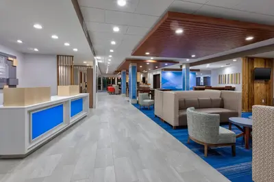 a lobby of a hospital with chairs and tables at Holiday Inn Express & Suites Wooster by IHG in Wooster