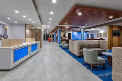 a lobby of a hospital with chairs and tables at Holiday Inn Express & Suites Wooster by IHG in Wooster