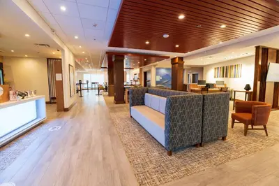 a lobby of a hospital with a couch and chairs at Holiday Inn Express & Suites Dayton East - Beavercreek by IHG in Beavercreek