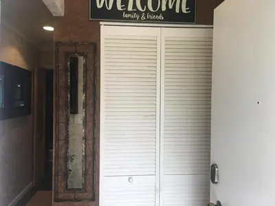 a white garage door in a room with a mirror at Home Sweet Home in Solon