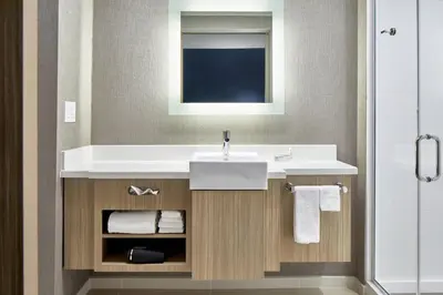 a bathroom with a sink and a mirror at SpringHill Suites by Marriott Columbus Dublin in Dublin