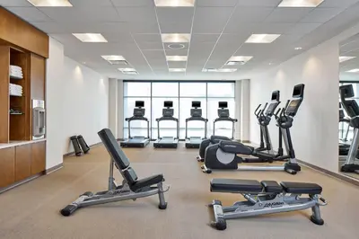 a gym with several treadmills and cardio machines at SpringHill Suites by Marriott Columbus Dublin in Dublin