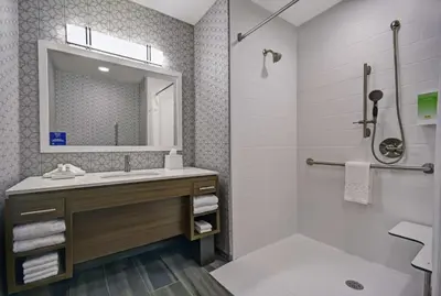 a bathroom with a sink and a mirror at Home2 Suites By Hilton Springdale Cincinnati in Springdale