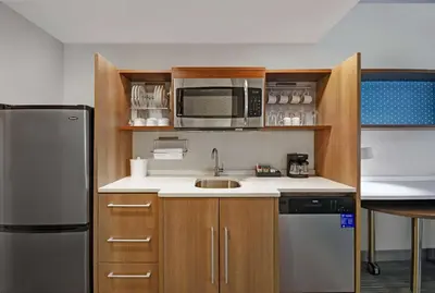 a small kitchen with a sink and a microwave at Home2 Suites By Hilton Springdale Cincinnati in Springdale