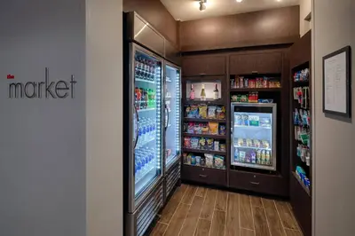 a grocery store with two refrigerators in a store at Residence Inn by Marriott Columbus Airport in Columbus