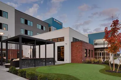 a building with a lawn in front of it at Residence Inn by Marriott Columbus Airport in Columbus
