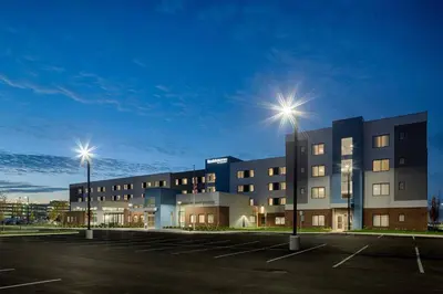 a building with two street lights in a parking lot at Residence Inn by Marriott Columbus Airport in Columbus