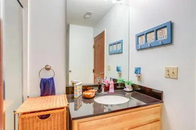a bathroom with a sink and a mirror at Waterfront Bass Island Retreat with Balcony and TV in Put-in-Bay