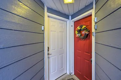 a door in a house with a wreath on the door at Waterfront Bass Island Retreat with Balcony and TV in Put-in-Bay