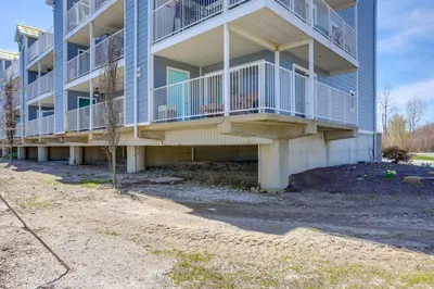 an apartment building with balconies on the side of it at Waterfront Bass Island Retreat with Balcony and TV in Put-in-Bay