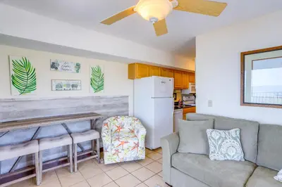 a living room with a couch and a refrigerator at Waterfront Bass Island Retreat with Balcony and TV in Put-in-Bay