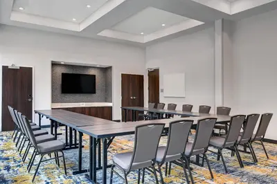 a conference room with a long table and chairs at TownePlace Suites by Marriott Columbus Dublin in Dublin