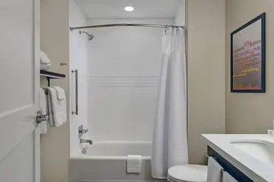 a bathroom with a shower and a toilet and a sink at TownePlace Suites By Marriott Lima in Lima
