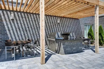 a patio with a grill and a table and chairs at TownePlace Suites By Marriott Lima in Lima