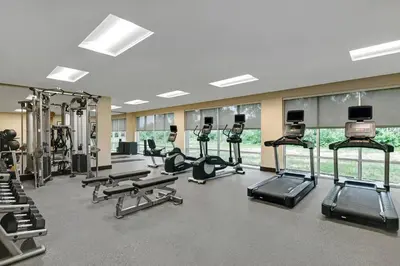 a gym with several treadmills and cardio machines at TownePlace Suites By Marriott Lima in Lima