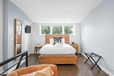 a bedroom with a bed and a window at 4 Apartments, Downtown, Walk to Cincy Stadiums! in Covington