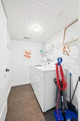 a room with a washing machine and a sink at 4 Apartments, Downtown, Walk to Cincy Stadiums! in Covington