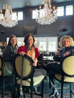 three women sitting in chairs in a salon at Inn of Chagrin in Chagrin Falls