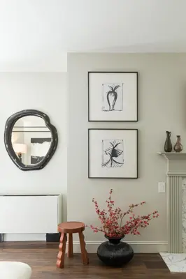 a living room with three framed pictures on the wall at Inn of Chagrin in Chagrin Falls
