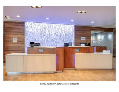 an office with a reception desk with a large window at Fairfield Inn & Suites by Marriott Jeffersonville I-71 in Jeffersonville