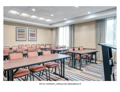 a conference room with tables and chairs in it at Fairfield Inn & Suites by Marriott Jeffersonville I-71 in Jeffersonville