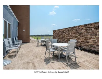 a row of tables and chairs on a patio at Fairfield Inn & Suites by Marriott Jeffersonville I-71 in Jeffersonville