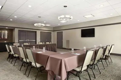 a conference room with a long table and chairs at Homewood Suites by Hilton Columbus OSU, OH in Columbus