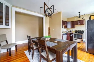 a kitchen and dining room with a table and chairs at Jungle House Luxury Stays - Columbus Downtown Short North in Columbus