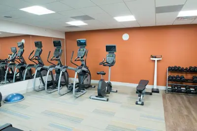 a gym with treadmills and cardio equipment in a room at Holiday Inn Express & Suites Dayton North - Vandalia by IHG in Dayton