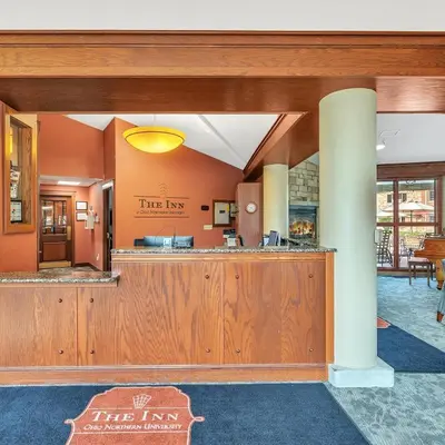 a tree inn lobby with a tree tax counter at The Inn at Ohio Northern University in Ada