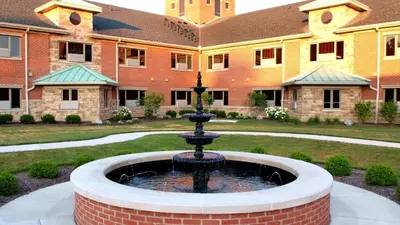 a fountain in the courtyard of a building at The Inn at Ohio Northern University in Ada