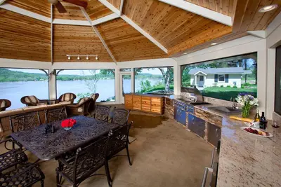 an open kitchen and dining room with a table and chairs at Riverside Inn Bed and Breakfast, Wedding Venue & Events in Warsaw