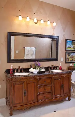 a bathroom with two sinks and a large mirror at Riverside Inn Bed and Breakfast, Wedding Venue & Events in Warsaw
