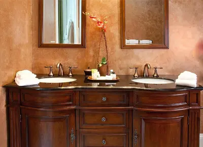a bathroom with two sinks and two mirrors at Riverside Inn Bed and Breakfast, Wedding Venue & Events in Warsaw