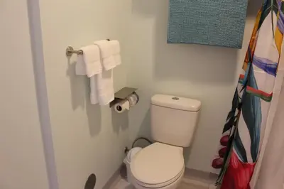 a small bathroom with a toilet and towels at Worthington of Logan in Logan