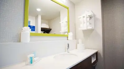 a bathroom with a sink and a mirror at Hampton Inn & Suites St Clairsville, Oh in Saint Clairsville