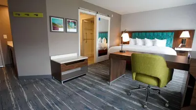 a hotel room with a bed and a desk and a desk at Hampton Inn & Suites St Clairsville, Oh in Saint Clairsville