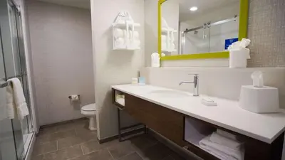 a bathroom with a sink and a toilet and a mirror at Hampton Inn & Suites St Clairsville, Oh in Saint Clairsville