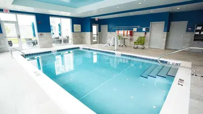a large swimming pool with blue water in a building at Hampton Inn & Suites St Clairsville, Oh in Saint Clairsville
