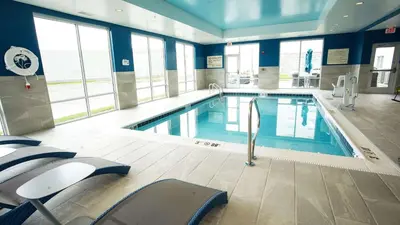 a large swimming pool in a building with windows at Hampton Inn & Suites St Clairsville, Oh in Saint Clairsville