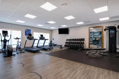 a gym with treadmills and exercise equipment in a room at Hampton Inn & Suites Canal Winchester Columbus in Canal Winchester