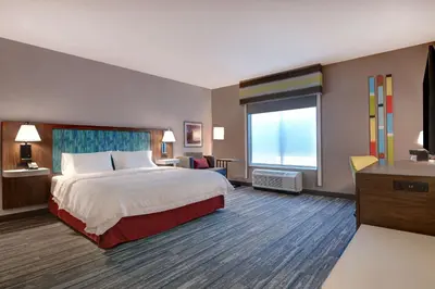 a hotel room with a bed and a window at Hampton Inn & Suites Canal Winchester Columbus in Canal Winchester