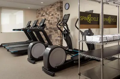 a gym with a row of exercise bikes in a room at Home2 Suites By Hilton Columbus Polaris in Columbus