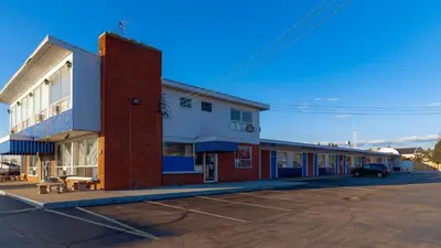 a row of buildings in a parking lot at Red Horse Motel Dayton Moraine in Dayton
