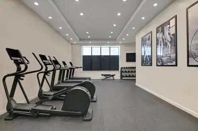 a row of treadmills in a fitness room at TownePlace Suites by Marriott Cincinnati Downtown in Cincinnati
